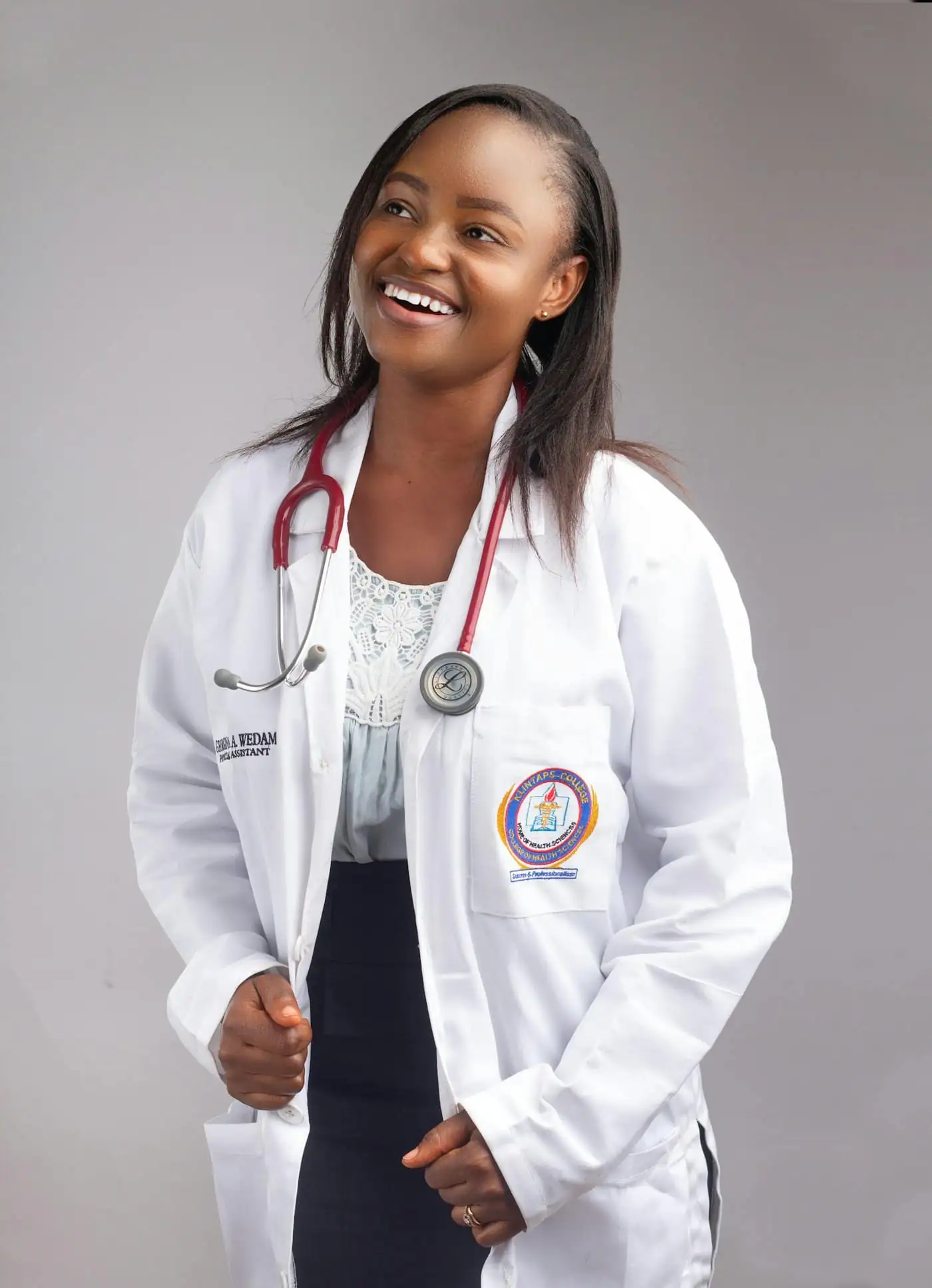 Dr Nadia, the partner vet, in a white coat with a stethoscope
